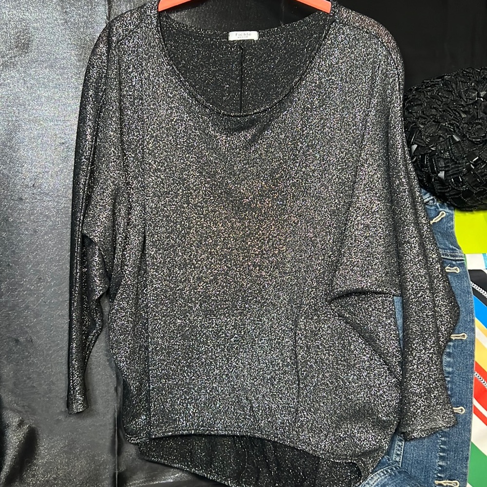 Fickle size Medium sparkly black and silver top, short front/long back,bat wing